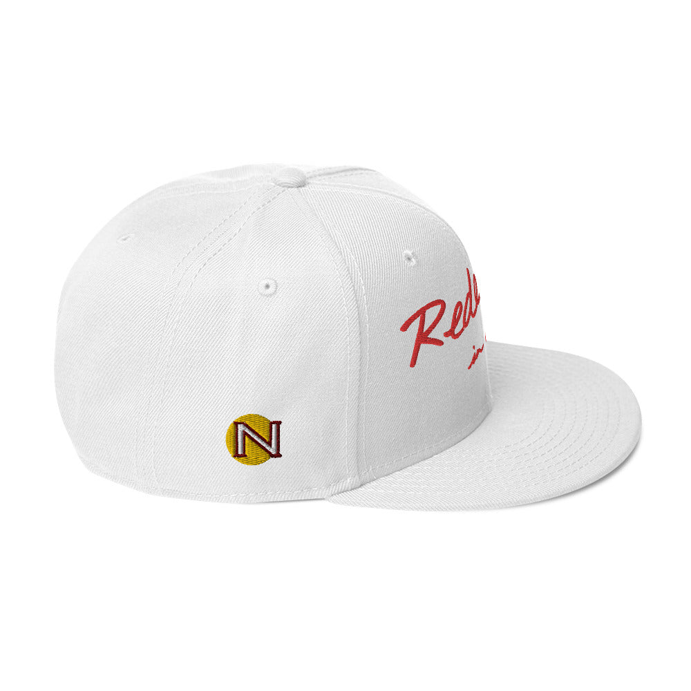 REDEEMED IN CHRIST (red embroidery) — Unisex Snapback Hat